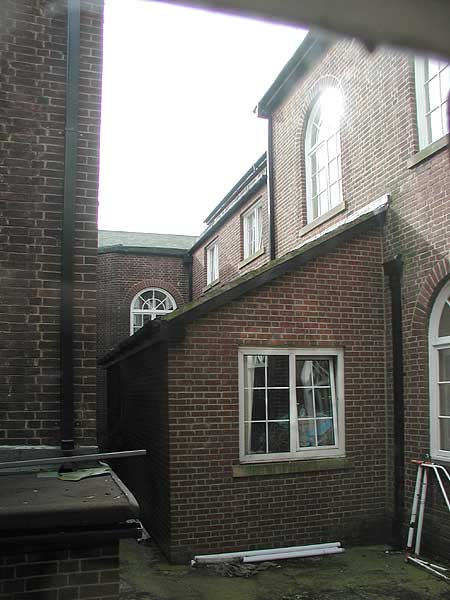 Downstairs - between stage and west corridor